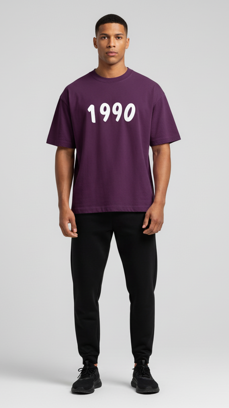 Person wearing a purple t-shirt with '1990' printed on it against a plain background
